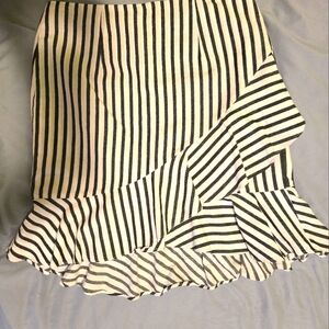 Adorable striped, ruffle zip closure 3/4 length mini skirt; new condition.